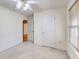 Cozy bedroom with neutral walls, a ceiling fan, and natural light at 25 Brookstone Ct, Covington, GA 30016