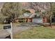 Charming brick home with blooming trees and a well-manicured lawn at 25 Brookstone Ct, Covington, GA 30016