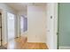 Hallway with hardwood floors leading to various rooms in the home at 25 Brookstone Ct, Covington, GA 30016
