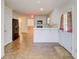 Bright kitchen featuring white cabinets and modern appliances at 25 Brookstone Ct, Covington, GA 30016