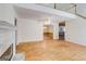 Cozy living space with hardwood floors, fireplace, and views into the dining room at 25 Brookstone Ct, Covington, GA 30016