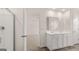 Bathroom with double sink vanity, tile floor, and separate glass shower at 313 Sound Cir # 140, Stockbridge, GA 30281