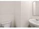 This half bathroom features a white toilet and a white sink at 313 Sound Cir # 140, Stockbridge, GA 30281