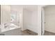 Bathroom with double sink vanity, tile floor, and separate tub and shower at 313 Sound Cir # 140, Stockbridge, GA 30281