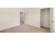 Bedroom with neutral carpet and an open doorway to a walk-in closet at 313 Sound Cir # 140, Stockbridge, GA 30281