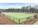 A fenced community dog park area featuring benches and well maintained grass at 313 Sound Cir # 140, Stockbridge, GA 30281