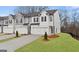 Beautiful townhome featuring white brick, a covered entrance, and an attached one car garage at 313 Sound Cir # 140, Stockbridge, GA 30281