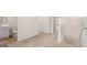 Carpeted hallway with view of the bathroom, stairs, and additional bedrooms at 313 Sound Cir # 140, Stockbridge, GA 30281