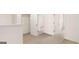 Upstairs hallway with access to several bedrooms featuring neutral carpet and white doors at 313 Sound Cir # 140, Stockbridge, GA 30281