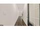 Inviting entryway boasts a dark wood floor and a view of the living room at 313 Sound Cir # 140, Stockbridge, GA 30281