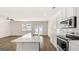 Modern kitchen with stainless steel appliances, quartz countertops, and open floor plan at 313 Sound Cir # 140, Stockbridge, GA 30281