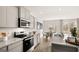 Modern kitchen with stainless appliances, granite countertops, and eat-in dining area at 313 Sound Cir # 140, Stockbridge, GA 30281