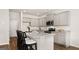 Well-lit kitchen featuring granite countertops, stainless steel appliances, and barstool seating at 313 Sound Cir # 140, Stockbridge, GA 30281