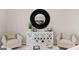 Cozy living room with stylish decor, including a mirror, furniture, and accent chairs at 313 Sound Cir # 140, Stockbridge, GA 30281