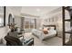 Spacious bedroom with carpet flooring, a tray ceiling, and natural light at 313 Sound Cir # 140, Stockbridge, GA 30281