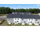 Back view of new townhomes showing private patios and well-maintained landscaping at 313 Sound Cir # 140, Stockbridge, GA 30281