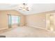 Bright bedroom featuring carpet, ceiling fan, and access to another room at 422 Northstar Dr, Villa Rica, GA 30180