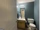 Small bathroom with single vanity and toilet at 245 Mckenzie Dr, Stockbridge, GA 30281