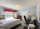 Bright bedroom with window, and gaming setup at 245 Mckenzie Dr, Stockbridge, GA 30281