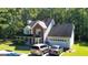 Two-story house with attached garage and large yard at 245 Mckenzie Dr, Stockbridge, GA 30281