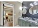 Double vanity bathroom with granite countertops and a view of bedroom at 105 Parks Pl, Sharpsburg, GA 30277