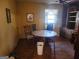 Small dining room with wood floors and built-in shelving at 8587 Cumming Hwy, Canton, GA 30115