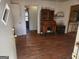 Home entry with hardwood floors and vintage secretary at 8587 Cumming Hwy, Canton, GA 30115