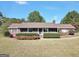 Brick ranch house with covered porch and landscaped yard at 2676 Benton Dr, Jonesboro, GA 30236