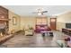 Cozy living room featuring hardwood floors, a fireplace, and ample natural light at 2676 Benton Dr, Jonesboro, GA 30236