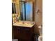 Clean bathroom with dark vanity and a large mirror at 898 Sw Oak Sw St # 3402, Atlanta, GA 30310