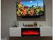 Entertainment center with electric fireplace and mounted TV at 898 Sw Oak Sw St # 3402, Atlanta, GA 30310
