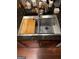 Modern stainless steel kitchen sink with built-in cutting board and drying rack at 898 Sw Oak Sw St # 3402, Atlanta, GA 30310