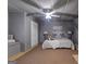 Spacious basement bedroom with ceiling fan and built-in window seat at 443 Abbey Pl, Villa Rica, GA 30180