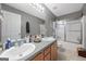 Clean bathroom with double vanity and shower/tub combo at 443 Abbey Pl, Villa Rica, GA 30180