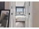 Bathroom with a large garden tub and updated flooring at 443 Abbey Pl, Villa Rica, GA 30180