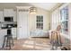 Breakfast nook with window seat and wood floors at 443 Abbey Pl, Villa Rica, GA 30180