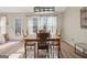 Bright dining room with hardwood floors and wooden table at 443 Abbey Pl, Villa Rica, GA 30180