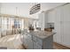 Gray kitchen island with granite countertop and breakfast bar at 443 Abbey Pl, Villa Rica, GA 30180