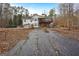 House backyard with deck and landscaping at 55 Rainey Ridge Dr, Oxford, GA 30054