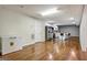 Open concept basement kitchen with stainless steel appliances and hardwood floors at 55 Rainey Ridge Dr, Oxford, GA 30054