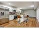 Modern basement kitchen with island, stainless steel appliances, and hardwood floors at 55 Rainey Ridge Dr, Oxford, GA 30054