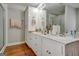 Bright bathroom boasts double sinks and ample storage at 55 Rainey Ridge Dr, Oxford, GA 30054