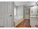 Elegant bathroom with soaking tub, double vanity, and walk-in shower at 55 Rainey Ridge Dr, Oxford, GA 30054