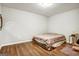 Spacious basement bedroom with large bed, hardwood floors, and natural light at 55 Rainey Ridge Dr, Oxford, GA 30054
