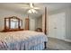 Bright bedroom with a four-poster bed and double doors at 55 Rainey Ridge Dr, Oxford, GA 30054