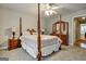Bedroom with four-poster bed, access to hallway at 55 Rainey Ridge Dr, Oxford, GA 30054