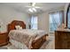 Bedroom with wooden bed frame and window at 55 Rainey Ridge Dr, Oxford, GA 30054