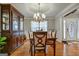Formal dining room with hardwood floors, chandelier, and built-in hutch at 55 Rainey Ridge Dr, Oxford, GA 30054