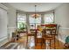 Cozy breakfast nook with a table for four and hardwood floors at 55 Rainey Ridge Dr, Oxford, GA 30054