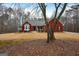 Red brick house with a covered porch and a yard with some trees at 55 Rainey Ridge Dr, Oxford, GA 30054